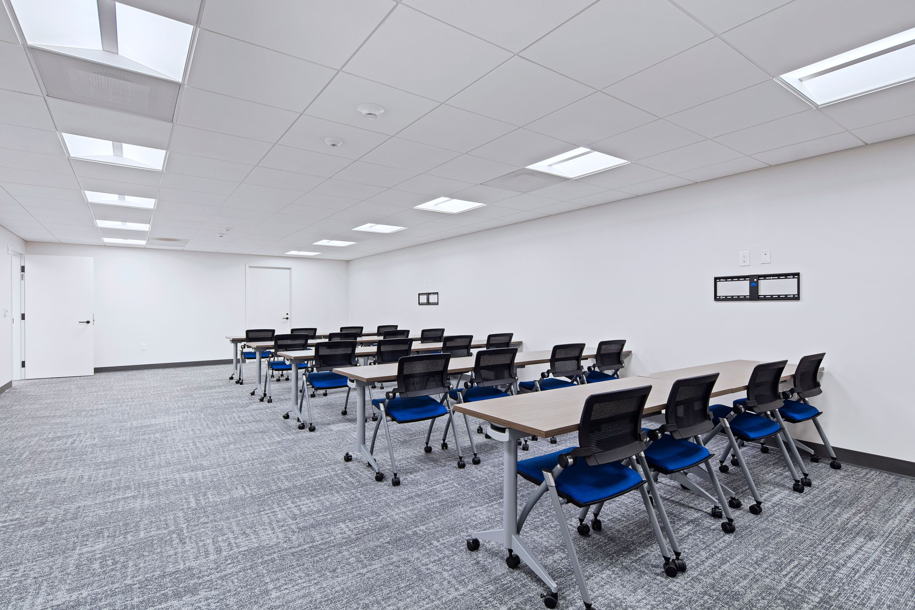 The training room at the Whitehead Electric office, rows of tables and chairs
