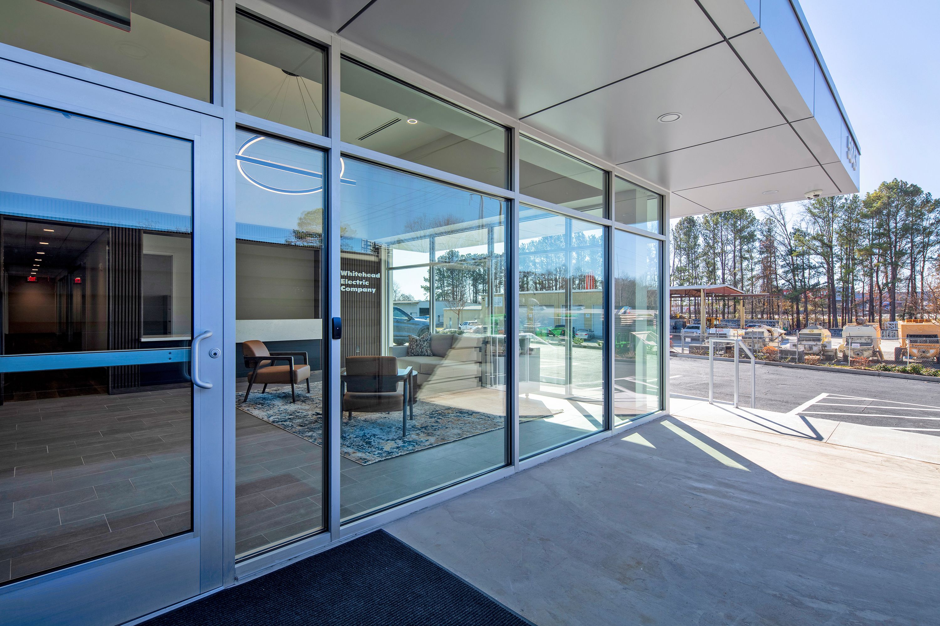 The glass entrance of the Whitehead Electric office, looking in toward the lobby